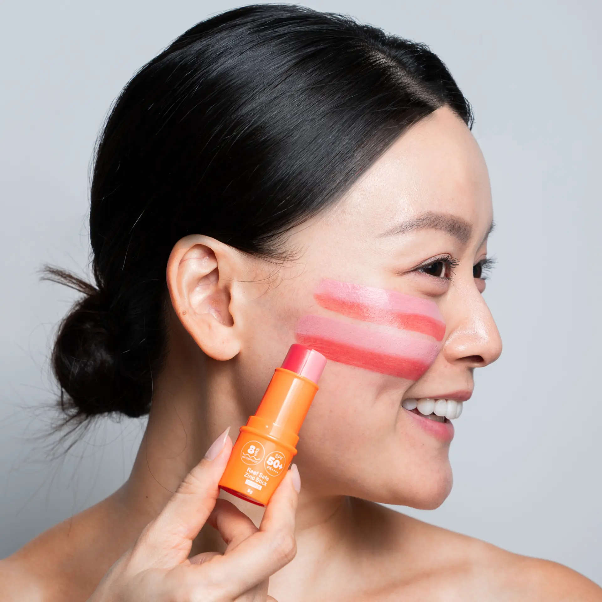 Swiping the Sunbeam zinc stick onto a cheek